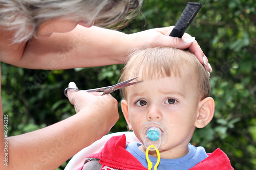 Photo: hair cutting first one-year-old child - trimming bangs hair cutting first one-year-old child - trimming bangs