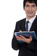 Man with clip-board taking notes