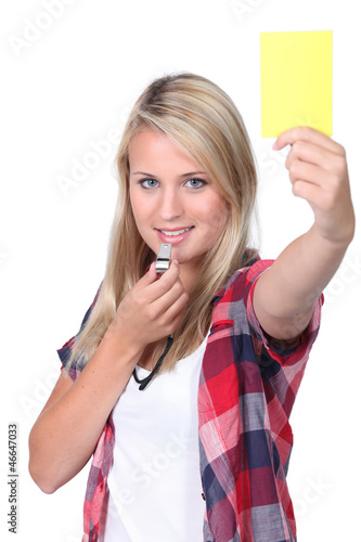Photo: Girl showing the yellow card Girl showing the yellow card