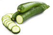 Fresh zucchini sliced close up on the white