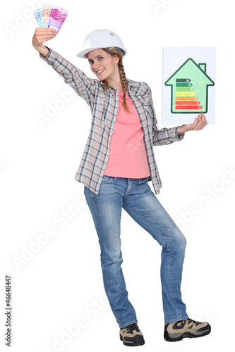 Photo: Builder with a energy rating sign Builder with a energy rating sign