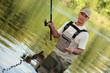 Oblique image of a fisherman on a river