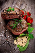 Grilled bbq steaks with fresh herbs and tomatoes