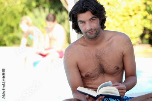 Photo: Man reading outside Man reading outside