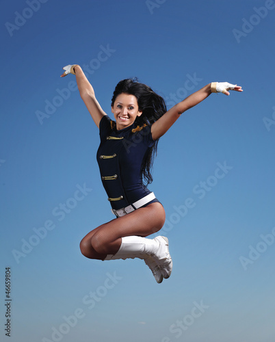 Photo: Young female dancer against white background Young female dancer against white background