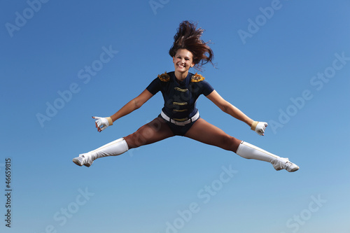 Photo: Young female dancer against white background Young female dancer against white background