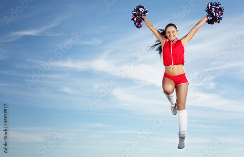 Photo: Young female cheerleader Young female cheerleader