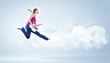 Photo: young woman playing on electro guitar and jumping young woman playing on electro guitar and jumping