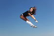 Young female dancer against white background