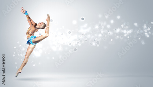 Photo: Young woman in gymnast suit posing Young woman in gymnast suit posing