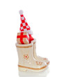 Christmas gifts in children's boots isolated over white