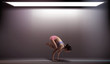Asian Woman doing yoga in an empty room