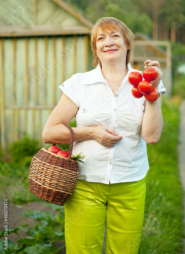 Photo: woman with vegetables harvest woman with vegetables harvest