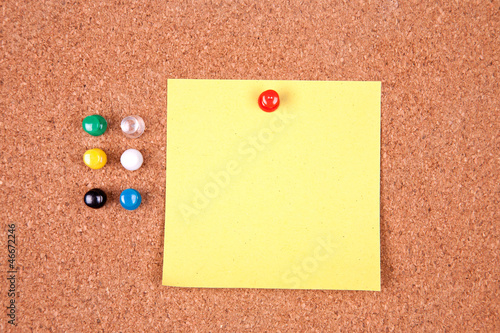 Photo: Cork bulletin board with notes. Cork bulletin board with notes.