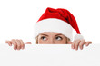 Foto: Female santa holding a christmas white card Female santa holding a christmas white card