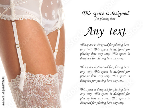 Photo: Close-up image of a young woman's leg in white stockings Close-up image of a young woman's leg in white stockings