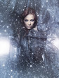 A young redhead woman posing on a snowy blue silk background