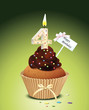 Cupcake mit Geburtstagskerze die Zahl 4