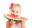 Little girl eating watermelon isolated on white background