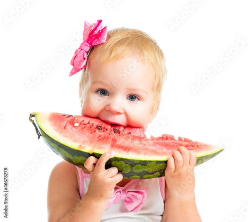 Photo: Little girl eating watermelon isolated on white background Little girl eating watermelon isolated on white background