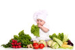 Baby cook with fresh vegetables on a white