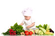 Baby cook with fresh vegetables on a white