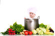 Baby cook with pan and vegetables on a white