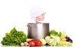 Baby cook with pan and vegetables on a white