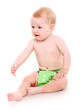 Cute little baby in green diapers in studio