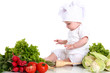Baby cook with fresh vegetables on a white