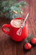 Hot cocoa in mug and chocolates. Selective focus