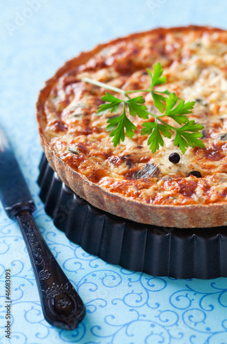 Photo: Quiche with tuna and capers. Selective focus Quiche with tuna and capers. Selective focus