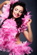 Elated positive woman in pink dress listening to the music
