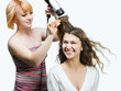 Hairdresser makes hairstyle