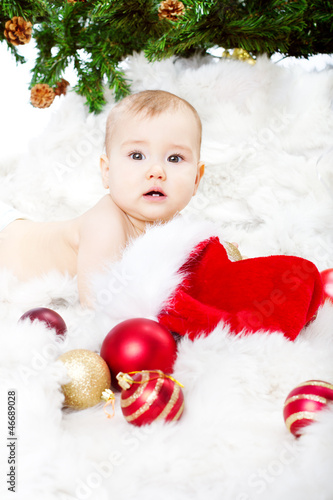 Photo: Christmas baby lying on fur Christmas baby lying on fur