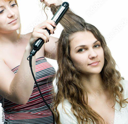 Photo: Hairdresser makes hairstyle Hairdresser makes hairstyle