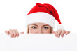 Foto: Female santa holding a christmas white card Female santa holding a christmas white card