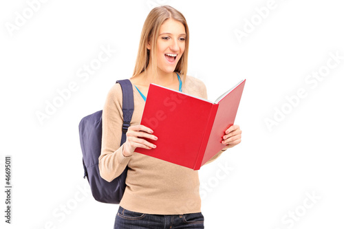 Photo: A female student reading a book A female student reading a book