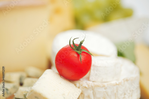 Photo: cheese on a wooden table cheese on a wooden table