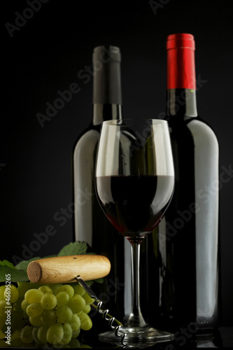 Photo: two bottle of red and white wine two bottle of red and white wine