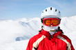 Photo: Closeup portrait of a female skier standing on a skiing slope Closeup portrait of a female skier standing on a skiing slope