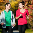 Young man and woman jogiing
