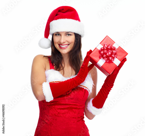 Photo: Santa helper Christmas girl with a present. Santa helper Christmas girl with a present.