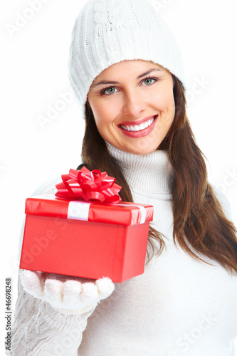 Photo: Beautiful young Christmas girl with gift. Beautiful young Christmas girl with gift.
