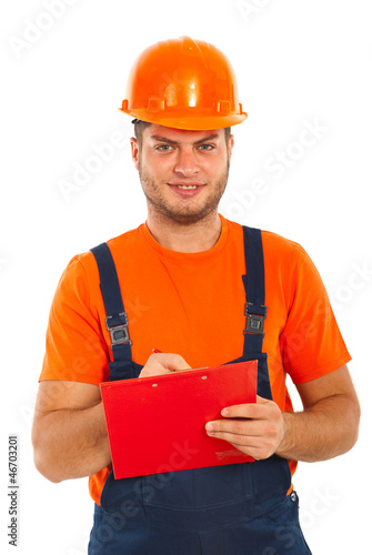 Photo: Builder man write to a clipboard Builder man write to a clipboard