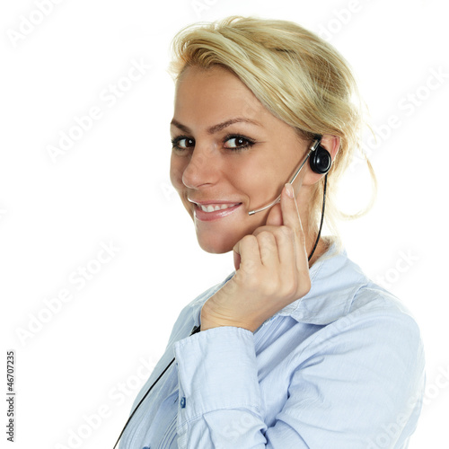 Photo: Charming girl with headset having a call Charming girl with headset having a call
