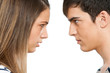Teen couple with cross face expression.