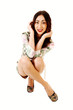 Woman crouching on floor.