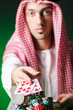 Arab playing in casino - gambling concept with man
