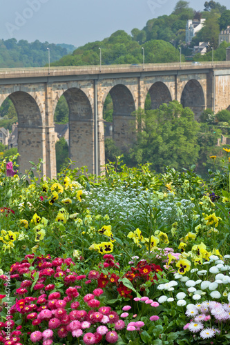 Photo: Bright Flowerbed and tall stone bridge Bright Flowerbed and tall stone bridge